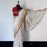 Onam Special Linen Saree – Off-White with Gold & Red Borders & Tassels